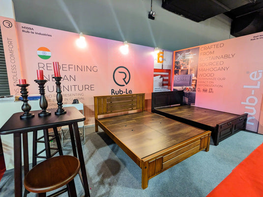 2 bed frames with candle holders in a wooden stand at MIFF exhibition