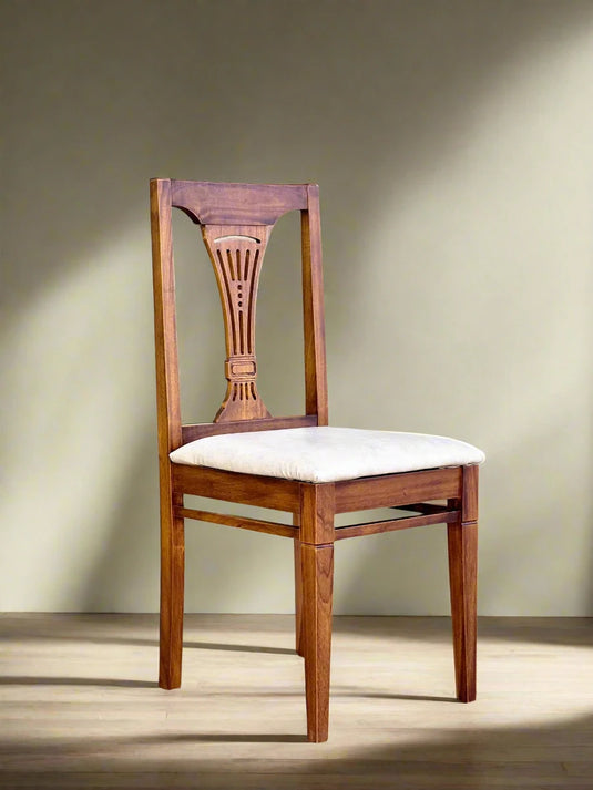 A teak color wooden dining chair with a white cushion in a livingroom