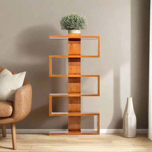 a wooden book shelf with a small plant arranged on the top in a living room