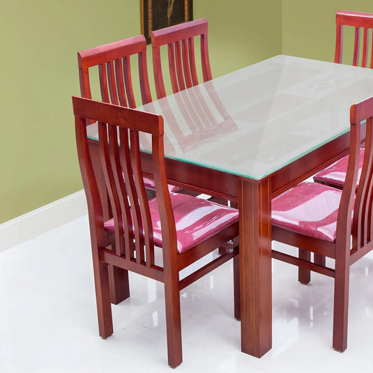a dining table with glass top and 5 chairs